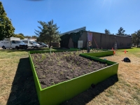 Spark-Y Youth Action Labs staff, apprentices, interns, and youth participants install a rain garden at Eastside Neighborhood Services